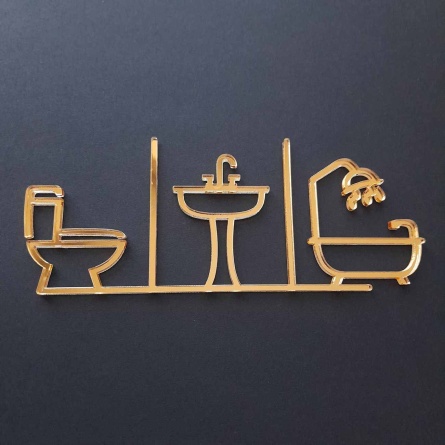Piktogram na označenie dverí zložený zo symbolu WC, umývadla a kúpeľne vyrezávaný laserom zo zlatého zrkadlového plexiskla